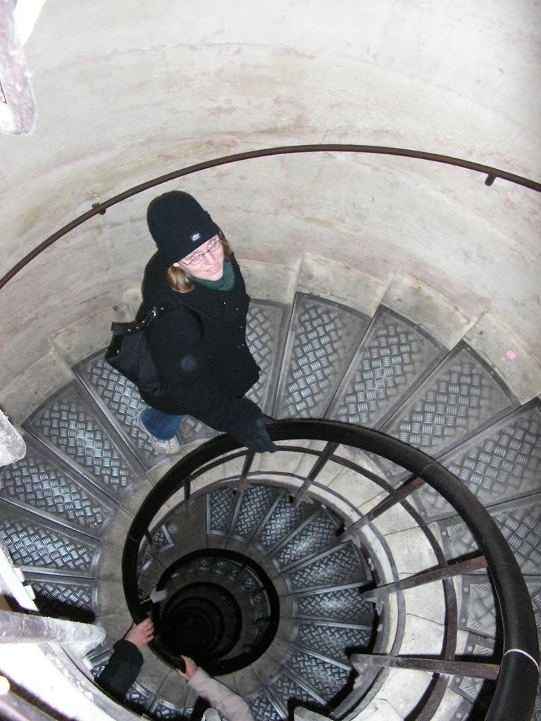 climbing the stairs of the Arc de Triomphe